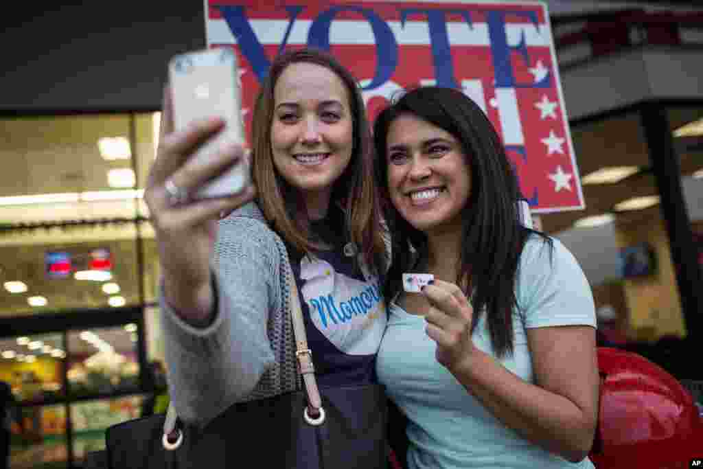 Lauren Koepp and Kara Smyth pose for a photo after casting their votes early on Election Day in Austin, Texas, Nov. 4, 2014.