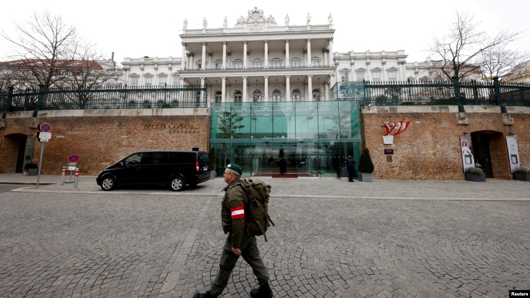 FILE - A member of the Austrian armed forces walks past Palais Coburg, site of talks on the Iran nuclear deal, in Vienna, Austria, Feb. 8, 2022.