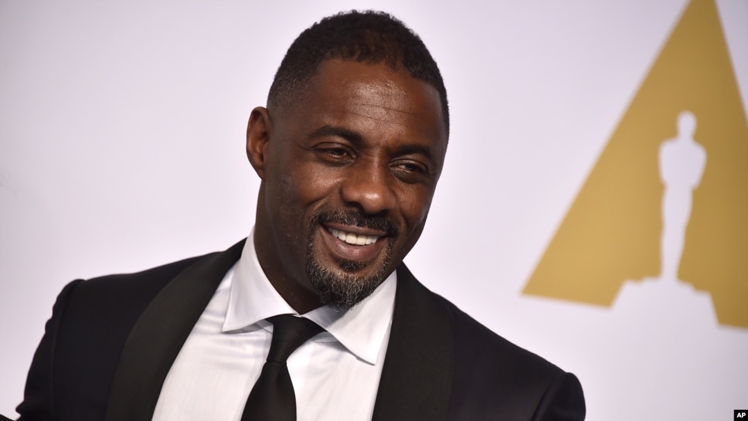 FILE - Actor Idris Elba, pictured at the Oscars in Los Angeles on Feb. 22, 2015, is one of 700 people invited to join the voting board of the Academy of Motion Picture Arts and Sciences.