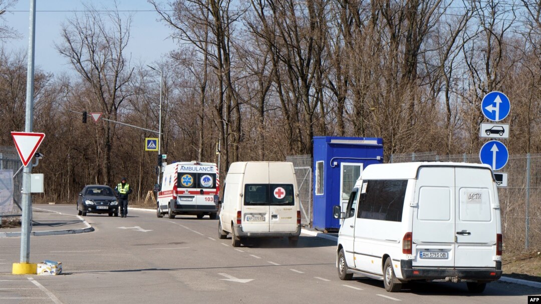 A convoy of volunteers carrying supplies for civilians stuck in Mariupol leaves Zaporizhzhya on March 29, 2022, amid Russian invasion of Ukraine.