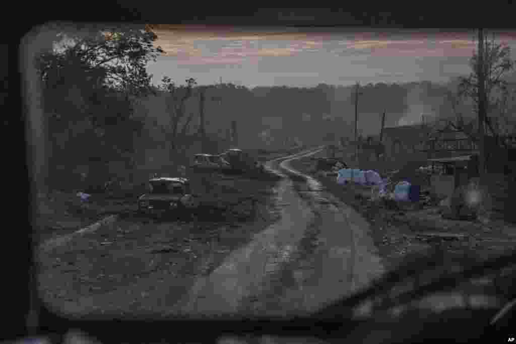 The gutted remains of cars lie along a road during heavy fighting at the front line in Severodonetsk, Luhansk region, Ukraine, June 8, 2022, amid Russia's invasion of Ukraine.