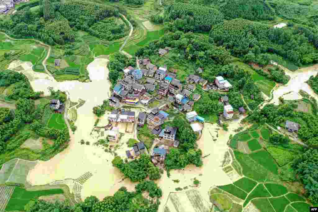This aerial photo shows flooded fields and buildings following heavy rains in Rongan in China's southern Guangxi region.
