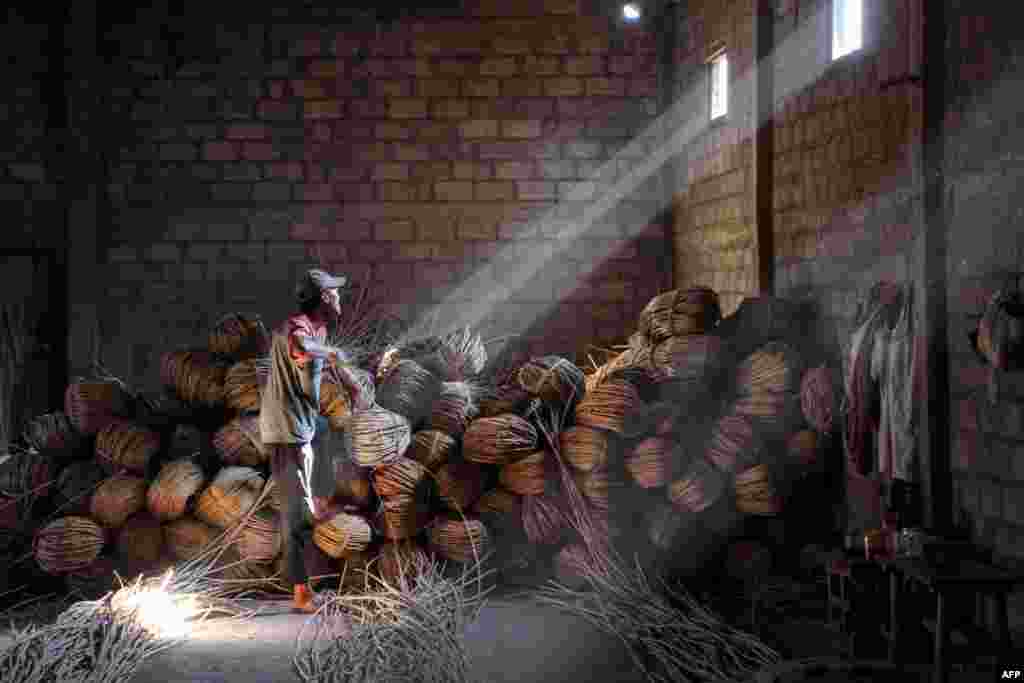 A craftsman works on unusual rattan coffins at Trangsan hamlet in Sukoharjo, Indonesia.