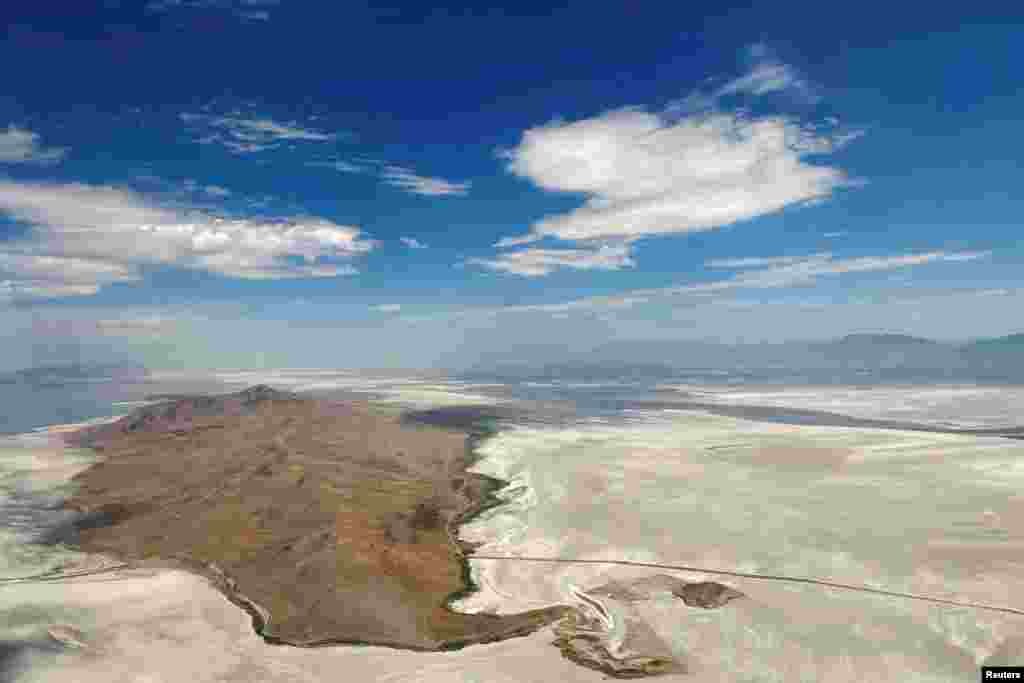 Dry land surrounds Antelope Island where there used to be water in the Great Salt Lake, in Salt Lake City, Utah, July 13, 2022.