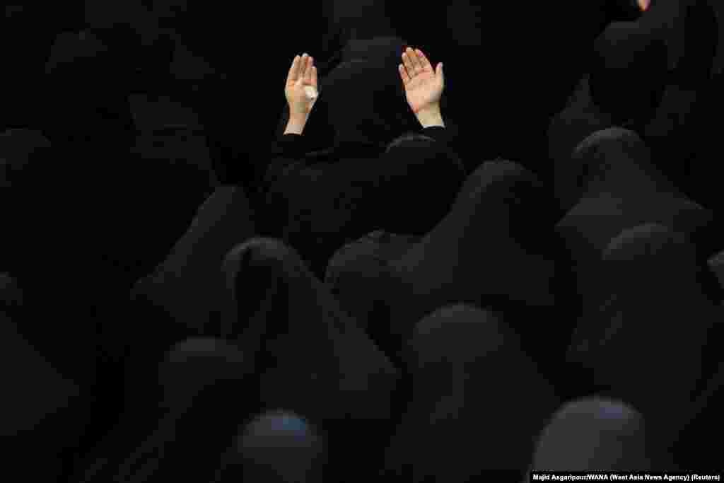 Iranian Shi'ite Muslim women take part in a mourning ritual ahead of Ashura, the holiest day on the Shi'ite Muslim calendar in Tehran, Aug. 7, 2022.