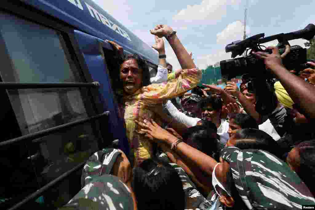 S. Jothimani, a lawmaker from India's main opposition Congress party reacts as she is being detained outside the Parliament in New Delhi. She and other lawmakers were protesting against the Enforcement Directorate summons to their party leader, increasing price hike and inflation in the country.
