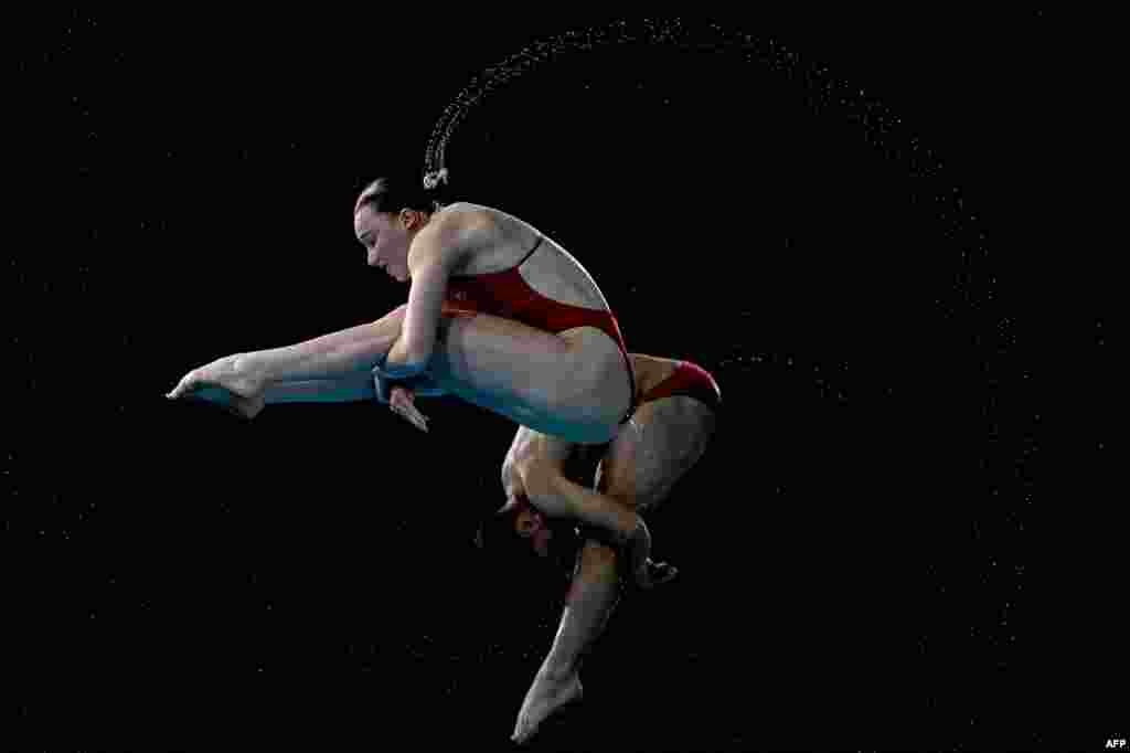 England's Jordan Houlden and England's Yasmin Harper compete during the mixed synchronized 3m springboard diving final on day eleven of the Commonwealth Games at Sandwell Aquatics Centre in Birmingham, central England.