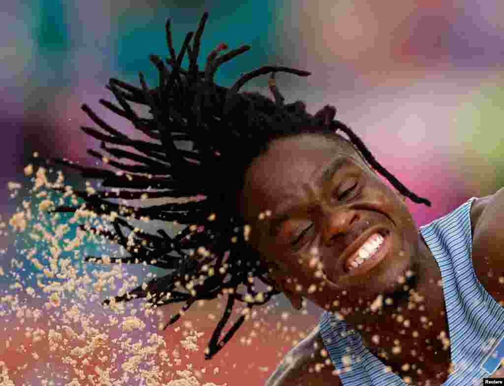 Botswana's Thapelo Monaiwa competes in the men's long jump qualifying round during the Commonwealth Games at the Alexander Stadium in Birmingham, Britain.