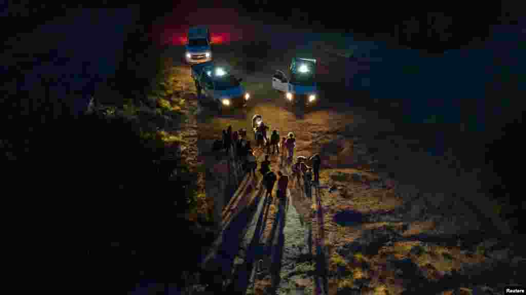 Asylum seeking migrants from Central and South America are registered by border patrol agents after they crossed the Rio Grande river into the United States from Mexico in Roma, Texas, June 13, 2022.