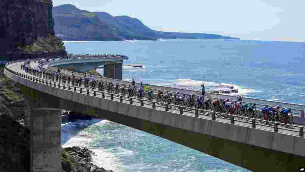 Riders cross the Sea Cliff Bridge during the elite men's road race at the world road cycling championships in Wollongong, Australia.