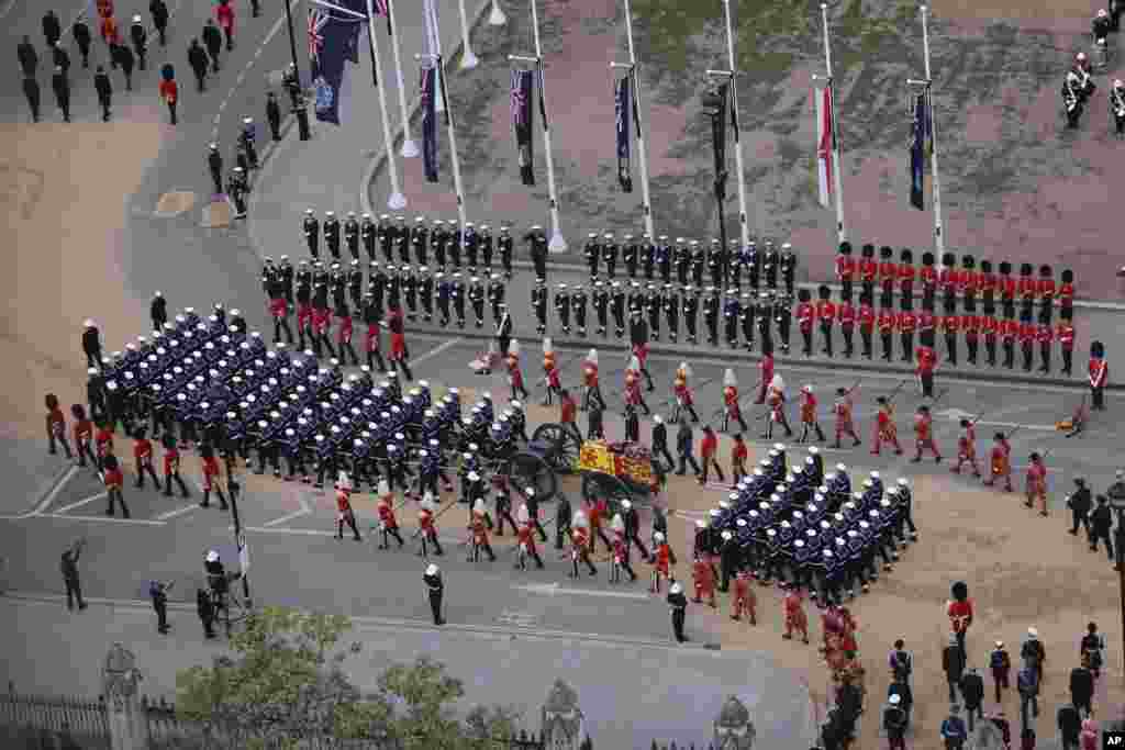 Members of the armed forces march during the funeral procession for Queen Elizabeth II from Westminster Hall to London’s historic Westminster Abbey.