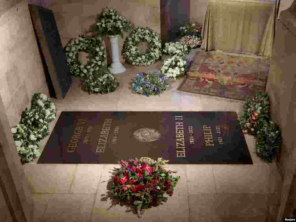 Handout photo from Buckingham Palace, Sept. 24, 2022, shows the ledger stone at the King George VI Memorial Chapel, St George's Chapel, Windsor Castle. An inscribed stone slab marking the death of Queen Elizabeth II has been laid in the Windsor Castle chapel where her coffin was interred, Buckingham Palace said.