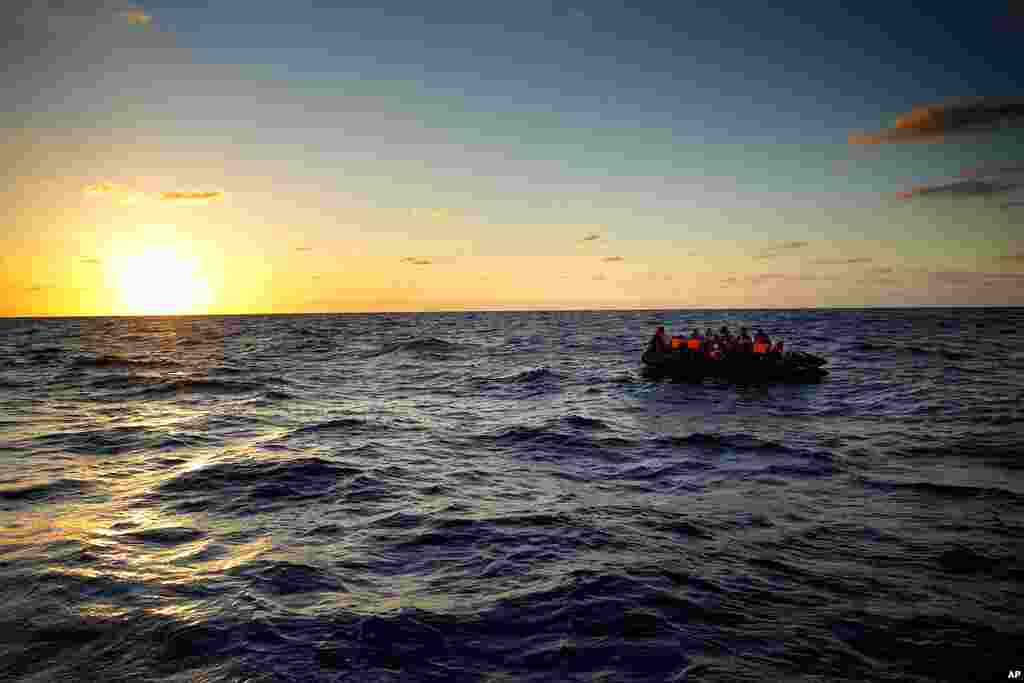 Migrants wait to be rescued by the Spanish NGO Open Arms lifeguards during a rescue operation at international waters zone of Libya SAR (Search and Rescue) in the Mediterranean Sea.