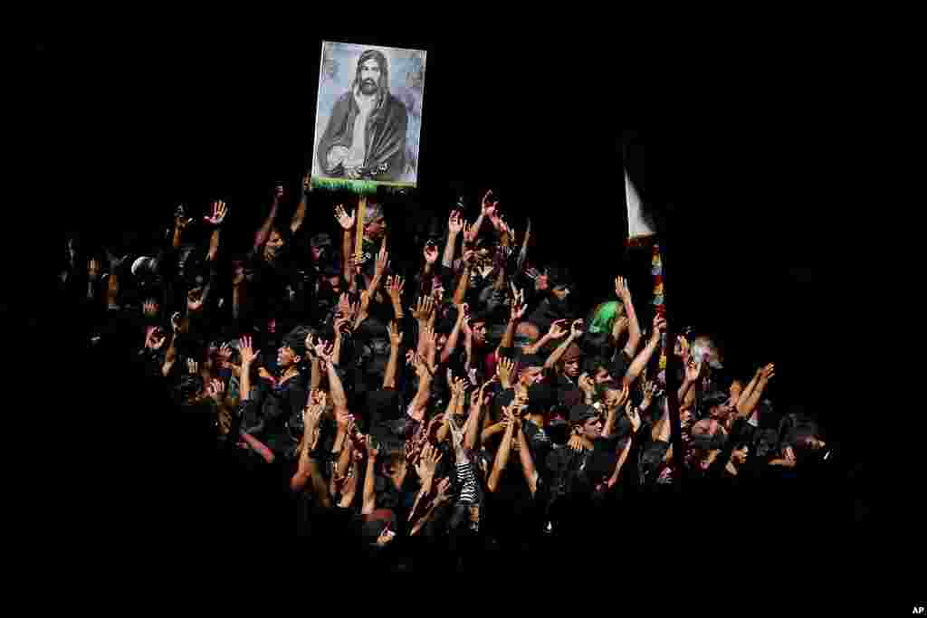 Shiite pilgrims mark the holiday of Arbaeen, in Karbala, Iraq. The holiday marks the end of the 40-day mourning period after the anniversary of the martyrdom of Imam Hussein, the Prophet Muhammad's grandson in the 7th century.