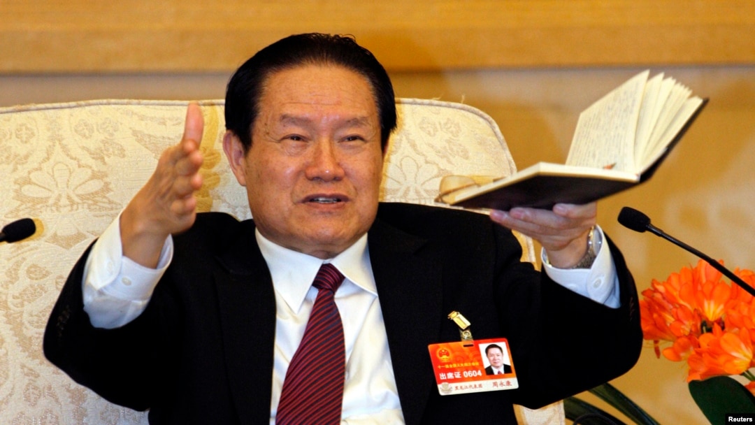 Zhou Yongkang gestures as he speaks at a group discussion of Shaanxi Province during the National People's Congress at the Great Hall of the People in Beijing, March 12, 2011.