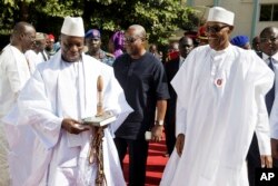 Yahya Jammeh, left, who has refused to step down as president of Gambia, is seen in Banjul, Jan.13, 2017.