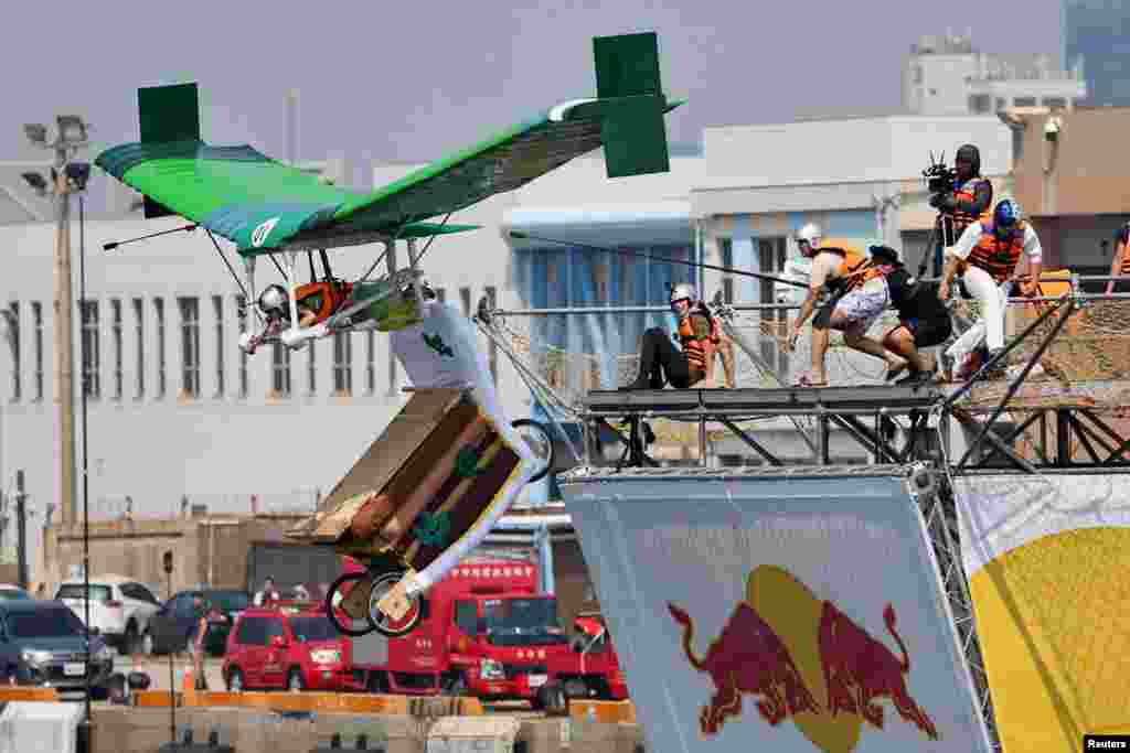 A participant operates a self-made flying machine during the Red Bull Flugtag Taiwan 2022 competition in Taichung, Taiwan.