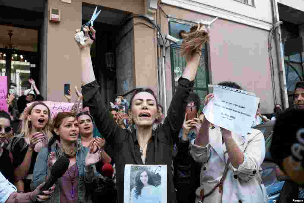 Nasibe Samsaei, an Iranian woman living in Turkey, reacts after she cut her hair during a protest following the death of Mahsa Amini, outside the Iranian consulate in Istanbul, Turkey. Mahsa Amini, a 22-year-old from Kurdistan province, fell into a coma and died following her arrest in Tehran last week over the country's strict new hijab policy.