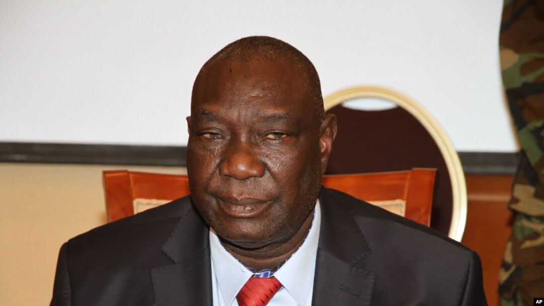 FILE - Michel Djotodia, the rebel leader who declared himself president, meets with members of the government armed forces, in Bangui, Central African Republic, March 28, 2013. 