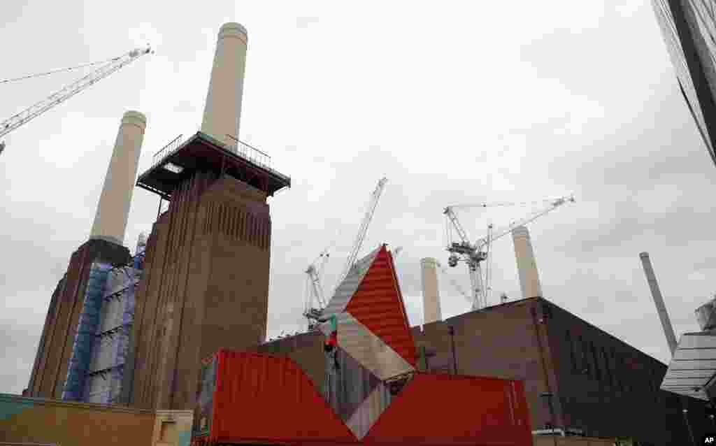 Satchie Noro performs a work entitled 'Origami' which will open the London's Dance Umbrella festival, at a site next to the landmark four tower Battersea Power Station in London.
