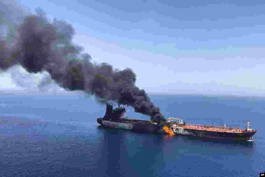An oil tanker is on fire in the sea of Oman. Two oil tankers near the strategic Strait of Hormuz were reportedly attacked, an assault that left one ablaze and adrift as sailors were evacuated from both vessels.