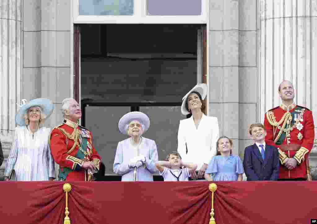 Camilla, the Duchess of Cornwall, Prince Charles, Queen Elizabeth II, Kate, Duchess of Cambridge, Prince Louis, Princess Charlotte, Prince George, and Prince William watch from the balcony of Buckingham Place after the Trooping the Color ceremony in London, June 2, 2022, on the first of four days of celebrations to mark the Platinum Jubilee. 