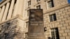 FILE - The Department of Commerce building is seen before an expected report of new home sales numbers in Washington, Jan. 26, 2022.