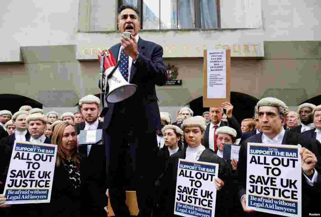 Jo Sidhu, Chair of the Criminal Bar Association, speaks during a strike by criminal barristers outside the 'Old Bailey' in London. British lawyers involved in criminal trials staged a walkout in a dispute over government funding, refusing to take on new cases or cover cases for colleagues which have overrun.