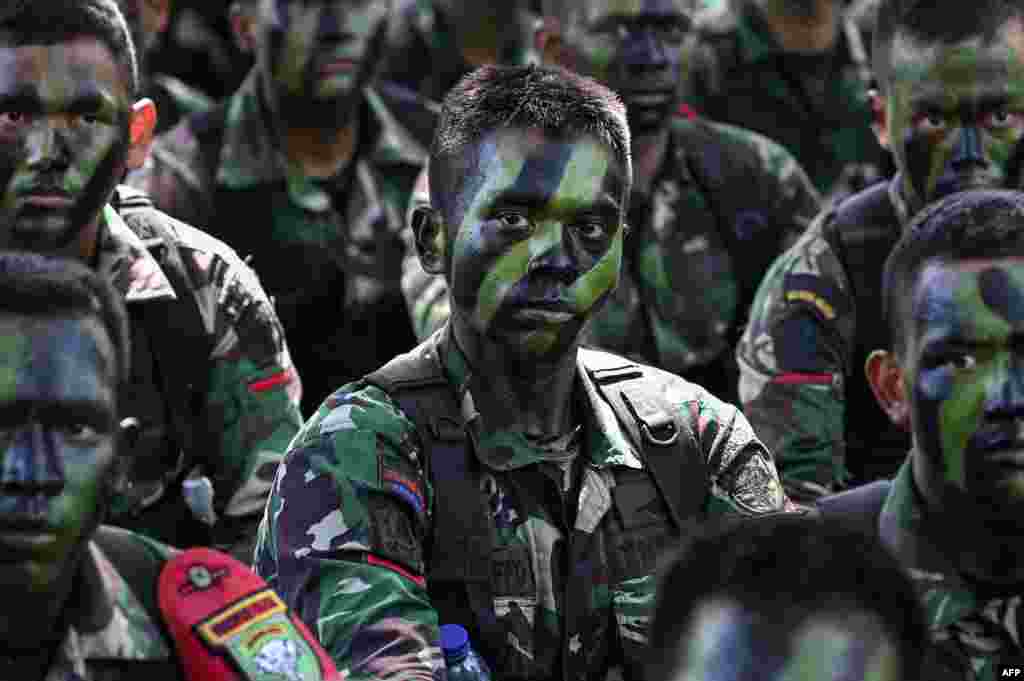 Soldiers from the Iskandar Muda military command attend a briefing after a military multitask forces exercise in Jantho, Aceh province, Indonesia.