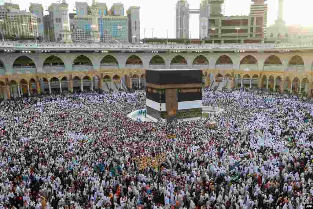 Muslim worshipers gather before the Kaaba at the Grand Mosque in Saudi Arabia's holy city of Mecca, Saudi Arabia, July 2, 2022.
