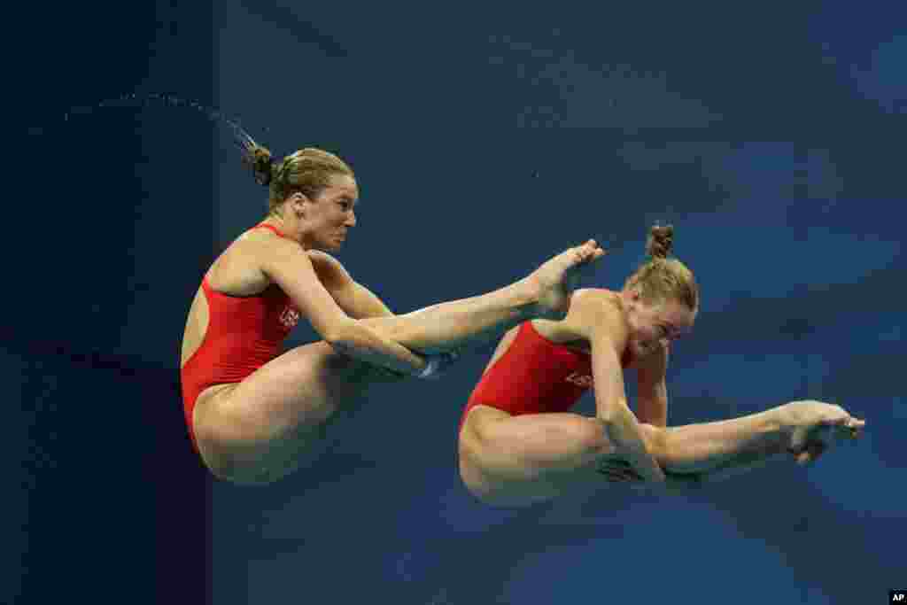 Delaney Schnell and Katrina Young of the United States compete during the women's diving synchronized 10m platform final at the 19th FINA World Championships in Budapest, Hungary.