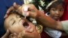 FILE - An Indonesian boy is given polio vaccine in Jakarta, Indonesia.