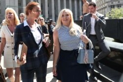 Virginia Giuffre, an alleged victim of Jeffrey Epstein, leaves after the hearing in the criminal case against Epstein, at Federal Court in New York, Aug. 27, 2019.