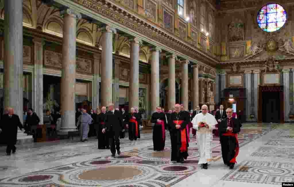 Newly elected Pope Francis walks in the Basilica of Santa Maria Maggiore during a private visit in Rome, March 14, 2013.