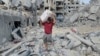 A Palestinian man salvages his belongings from the rubble after an Israeli airstrike in Gaza City on Oct. 10, 2023. The United Nations estimates that at least 200,000 of Gaza’s 2.2 million residents have been displaced in the fighting between Hamas militants and Israeli forces.