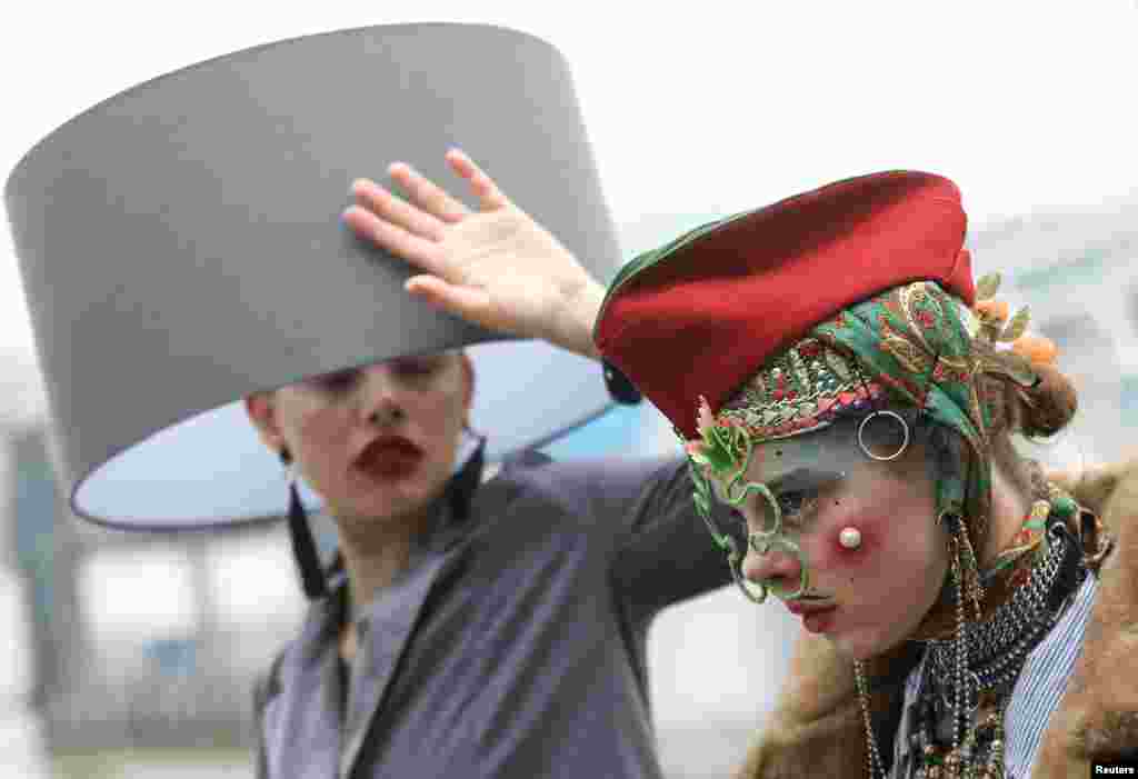 Participants take part in a 'Hat Walk' during London Hat Week in London.
