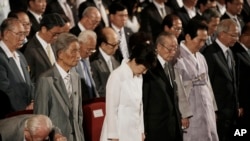 South Korean President Park Geun-hye, center, pays her tribute during a ceremony to celebrate Korean Liberation Day from Japanese colonial rule in 1945, at Seong Cultural Center in Seoul, South Korea, Monday, Aug. 15, 2016.