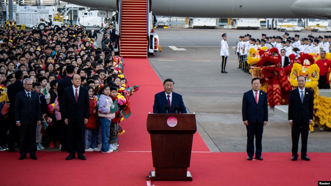 China's President Xi Jinping speaks upon his arrival at Macau's international airport in Macau on Dec. 18, 2024, ahead of celebrations for the 25th anniversary of Macau's handover from Portugal to China.