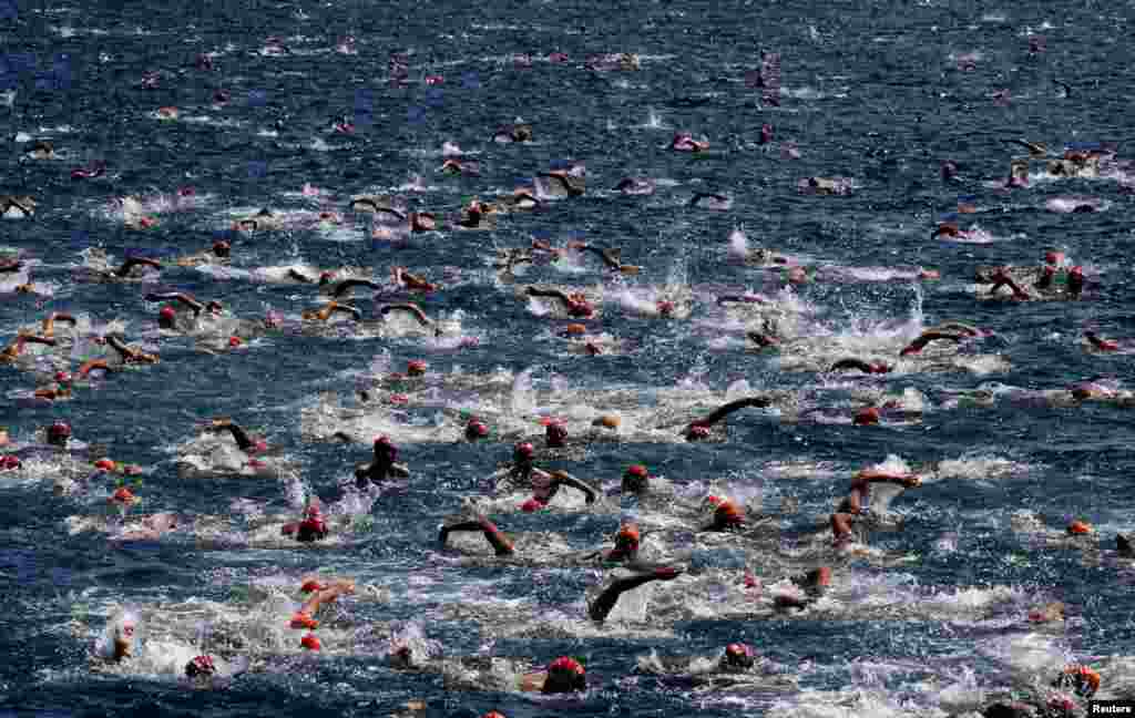 Competitors participate in the 31st Bosphorus Cross-Continental Swimming Race across the Bosphorus strait between Istanbul's Asian and European sides, Turkey.