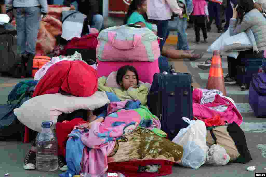 Venezuelan children sleep at the Binational Border Service Center in Tumbes, Peru, after a new migration law was imposed for all Venezuelan migrants to have valid visas and passports, June 15, 2019.