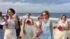 Fraidy Reiss, left, and backers of her “Unchained at Last” group celebrate passage of laws barring child marriage in Delaware and New Jersey. Assemblywoman Nancy Munoz, in the blue dress, sponsored the bill in New Jersey. (C. Presutti/VOA)