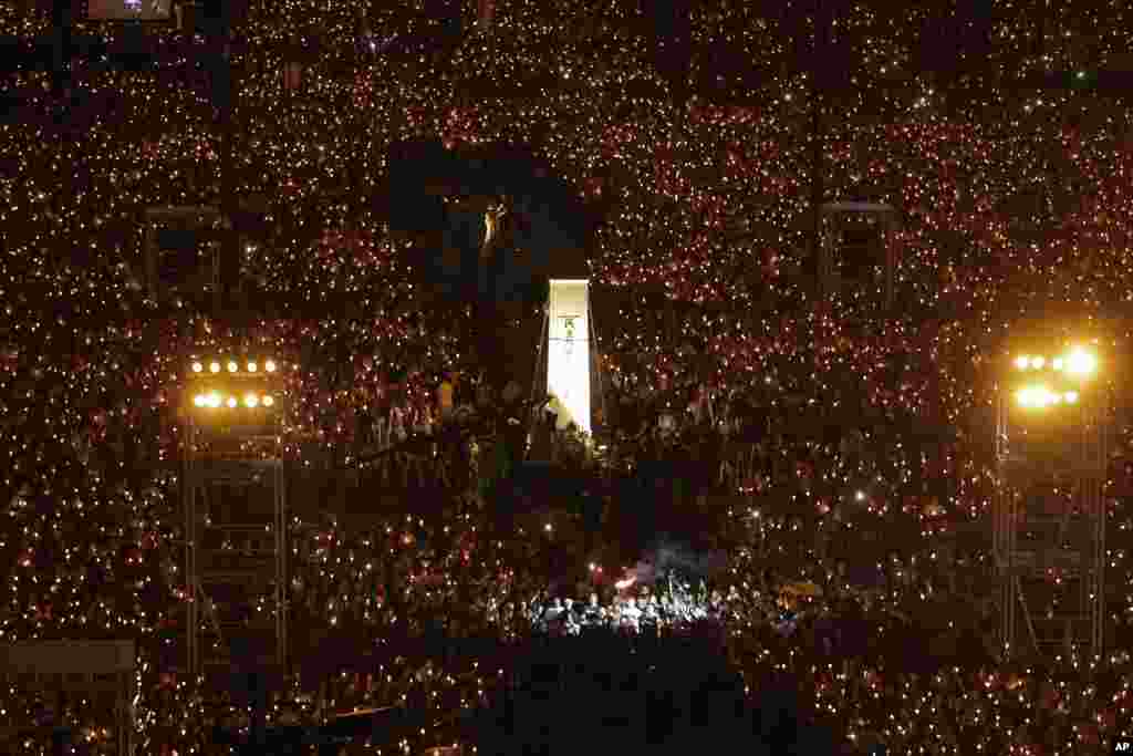 Thousands of people attend a candlelight vigil at Victoria Park in Hong Kong for victims of the Chinese government's brutal military crackdown three decades ago on protesters in Beijing's Tiananmen Square.