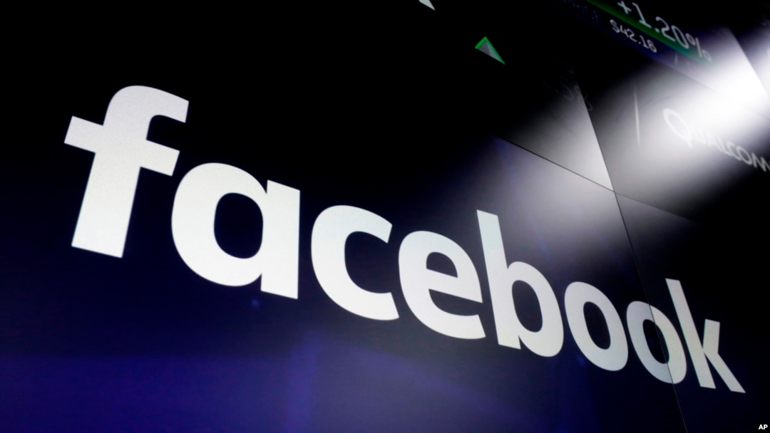 In this March 29, 2018 file photo shows the logo for Facebook at the Nasdaq MarketSite, in New York's Times Square. Facebook on Friday, Feb. 14, 2020.