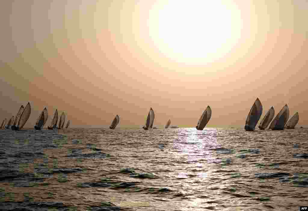 Sailors participate in the annual long-distance dhow sailing race, known as al-Gaffal, near Sir Abu Nuair island towards Dubai, UAE.