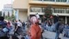 Protesters climb the barricades blocking off the government area of downtown Beirut, Nov. 19, 2019. (Heather Murdock/VOA) 