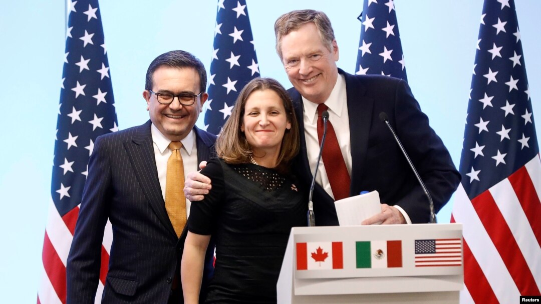 FILE - Mexican Economy Minister Ildefonso Guajardo, Canadian Foreign Minister Chrystia Freeland and U.S. Trade Representative Robert Lighthizer smile during a joint news conference on the closing of the seventh round of NAFTA talks in Mexico City, Mexico, in March.