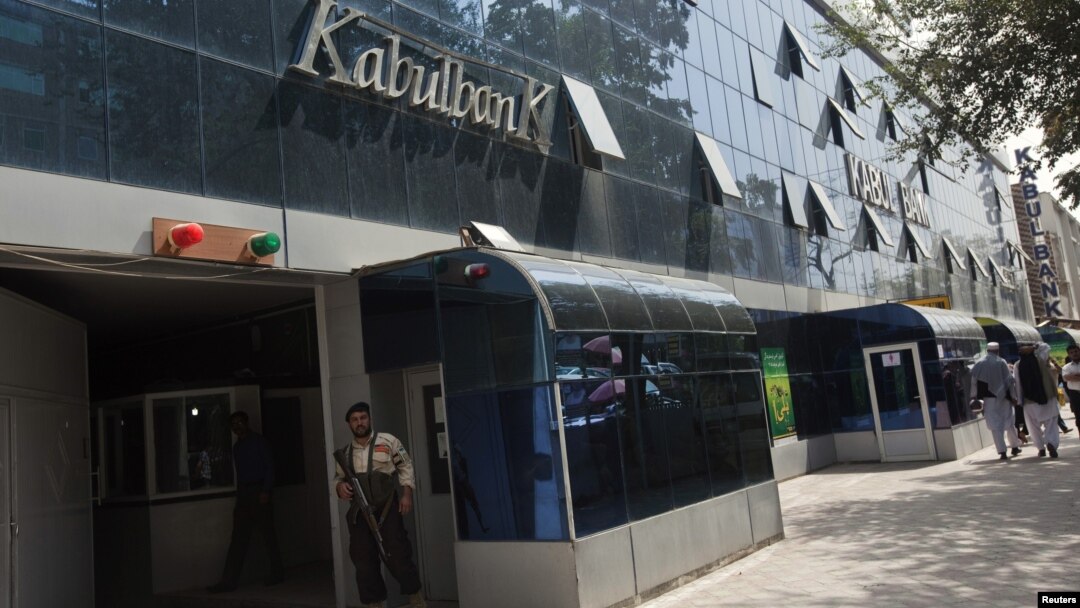 FILE - Security guard stands outside main office of Kabul Bank, September 1, 2010.