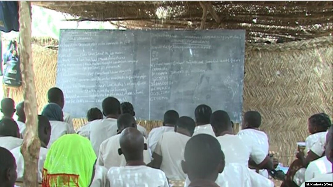 FILE - Schoolchildren are taught in makeshift classroom in Maroua, Cameroon, April 15, 2019.