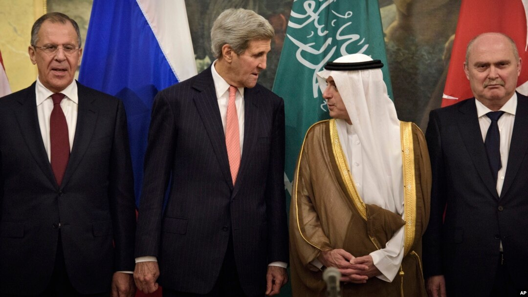From left, Russian Foreign Minister Sergei Lavrov, Secretary of State John Kerry, Saudi Foreign Minister Adel al-Jubeir and Turkish Foreign Minister Feridun Sinirlioglu stand together before a meeting in Vienna, Austria, Oct. 29, 2015.