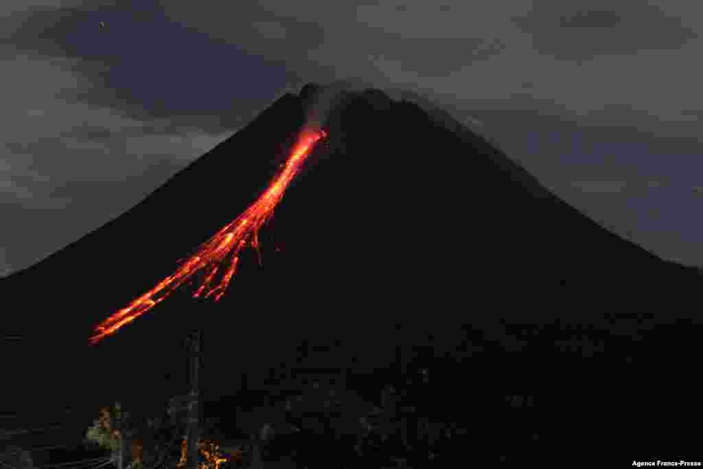 Mount Merapi, Indonesia’s most active volcano, spews ash and lava from its peak as seen from Sleman in Yogyakarta.